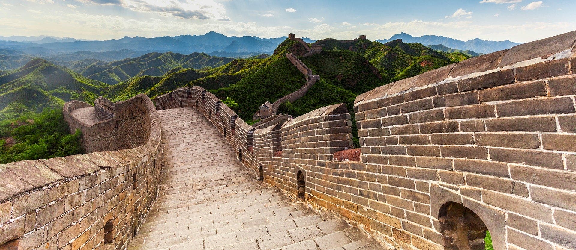 Great Wall of China stretching across mountain ridges
