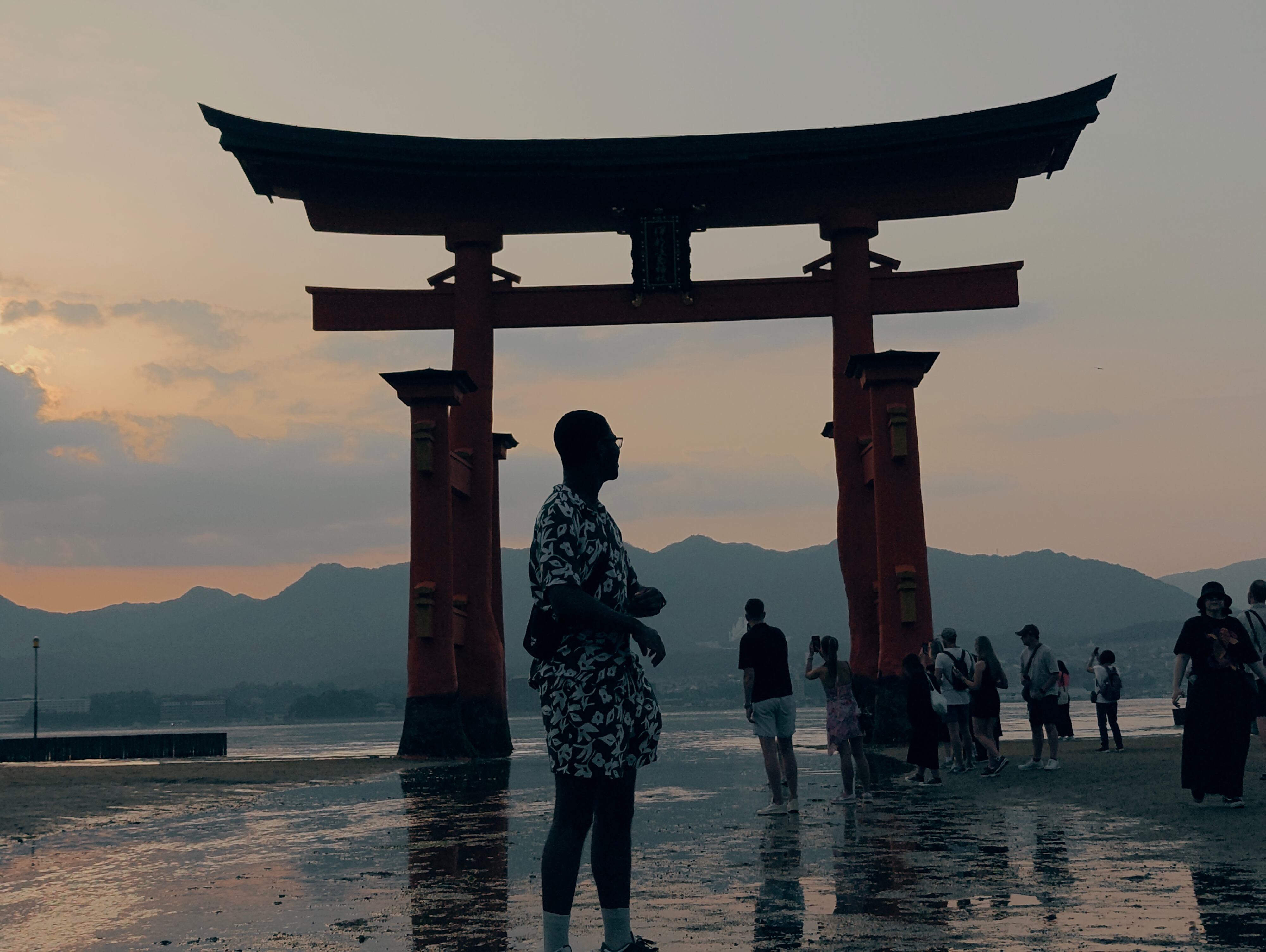 Sunset silhouette at Miyajima floating torii gate