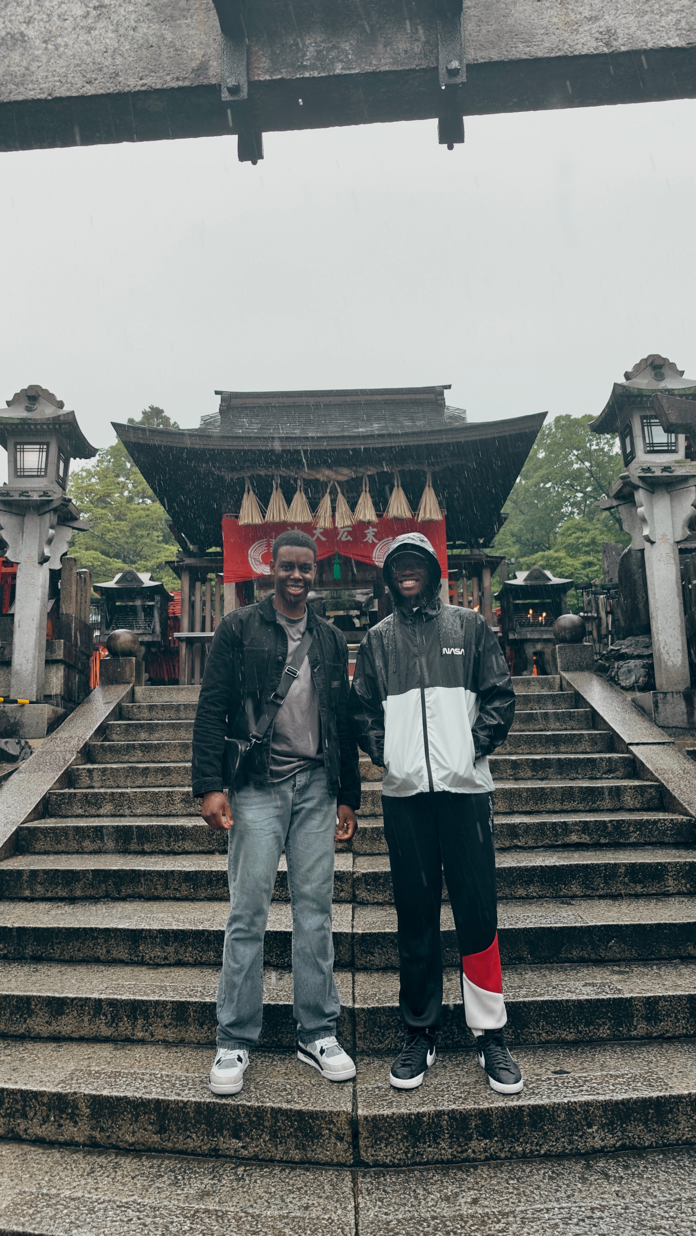 Friends at Japanese temple on a rainy day