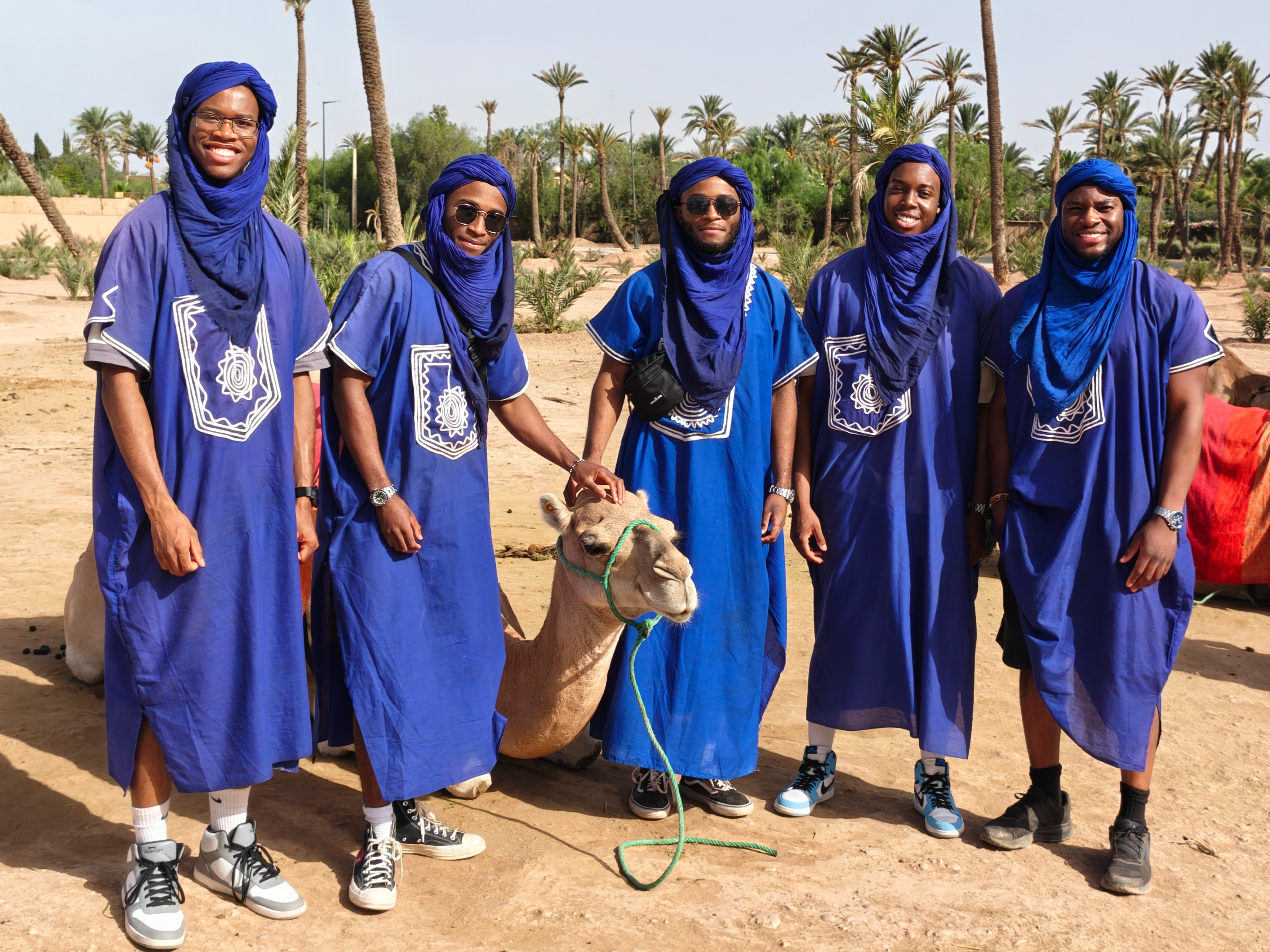Desert adventure in Morocco with traditional attire and camel